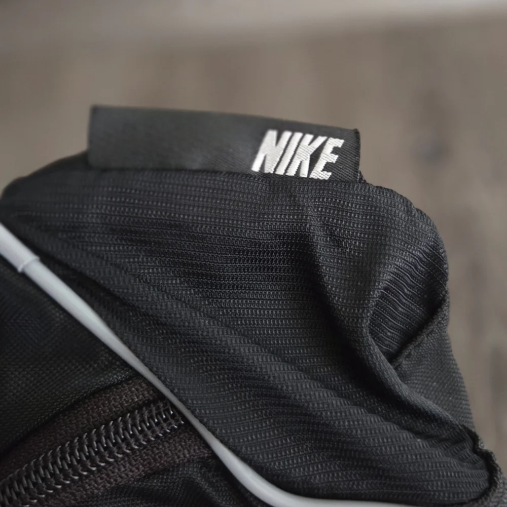 Nike Black Waist Bag with White Swoosh and Reflective Trim